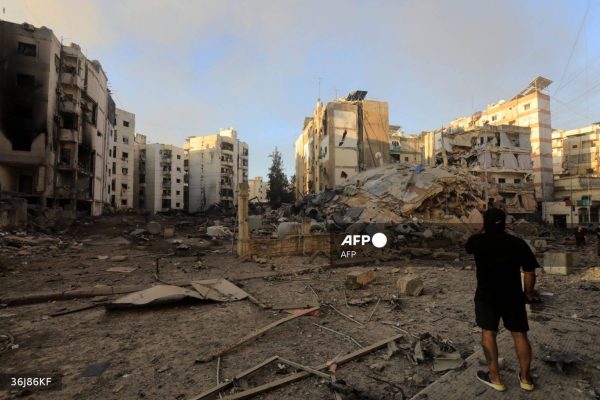 A resident checks the destruction in the aftermath of an Israeli strike on the neighbourhood of Mreijeh in Beirut's southern suburbs on October 4, 2024. - A source close to Hezbollah said Israel had conducted 11 consecutive strikes on the group's south Beirut stronghold late October 3, in one of the most violent raids since Israel intensified its bombardment campaign last week. (Photo by AFP)